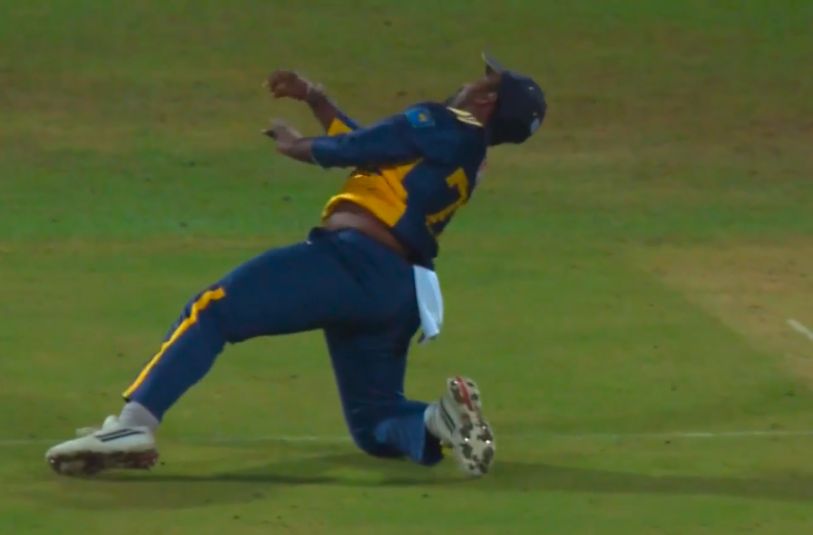 SAFE HANDS! Charith Asalanka grabs a brilliant low diving catch