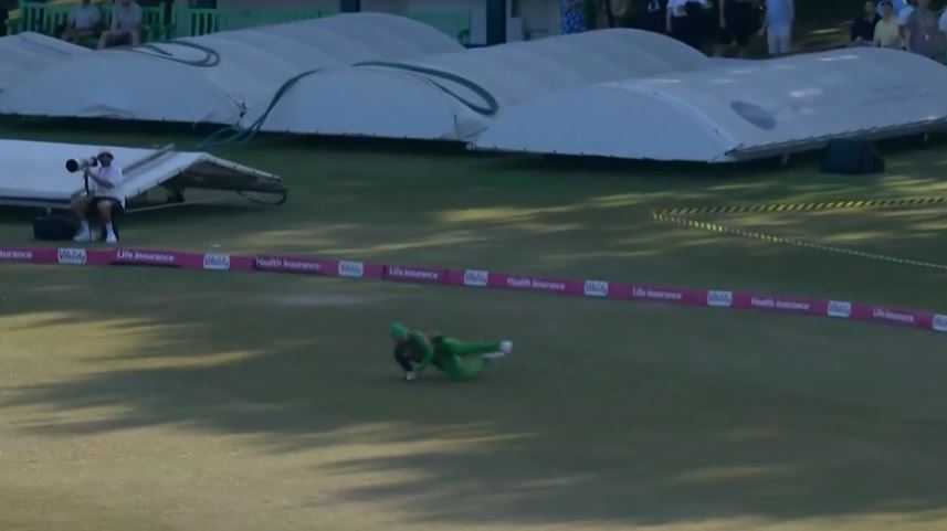 GOLLY! Tom Scriven leaped in to take an astounding catch