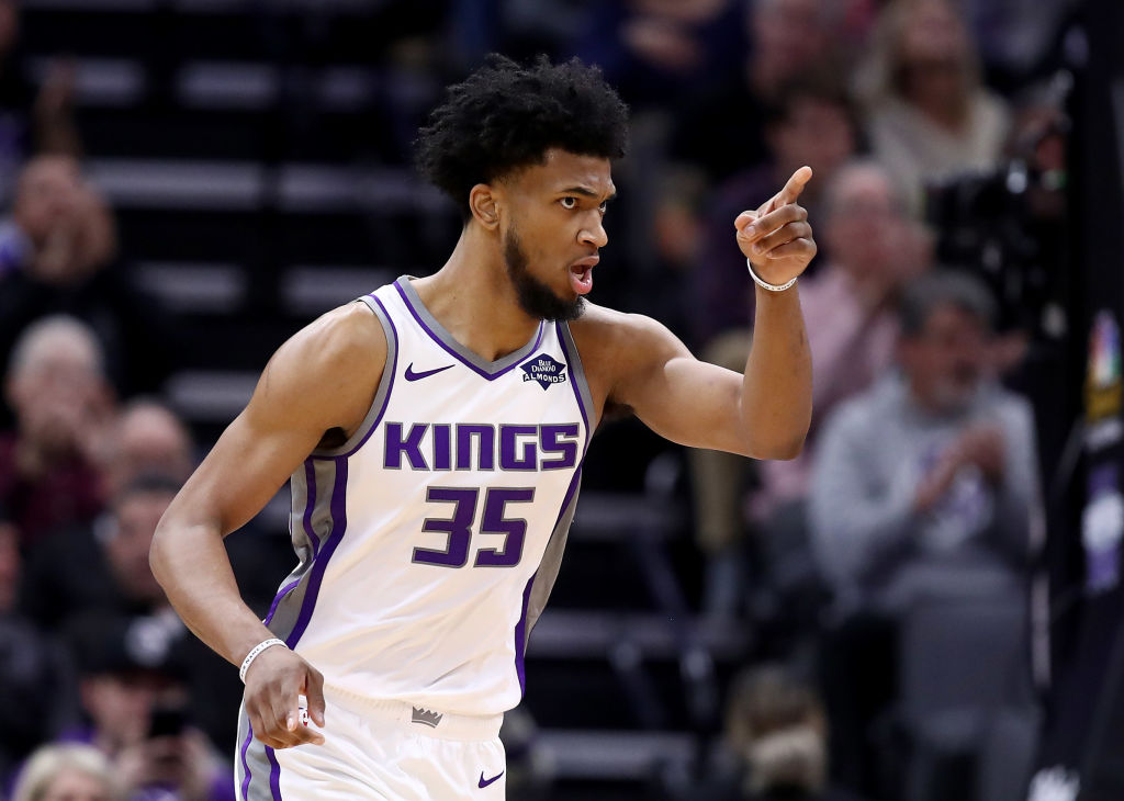 Kings share ball with eight in double-digits, silence Thunder 126-98